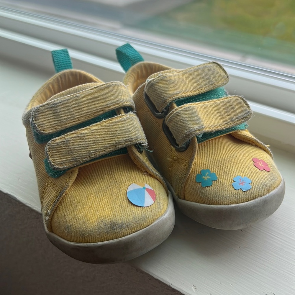 Ten little USED shoes with stickers. Size 4, mellow yellow color.